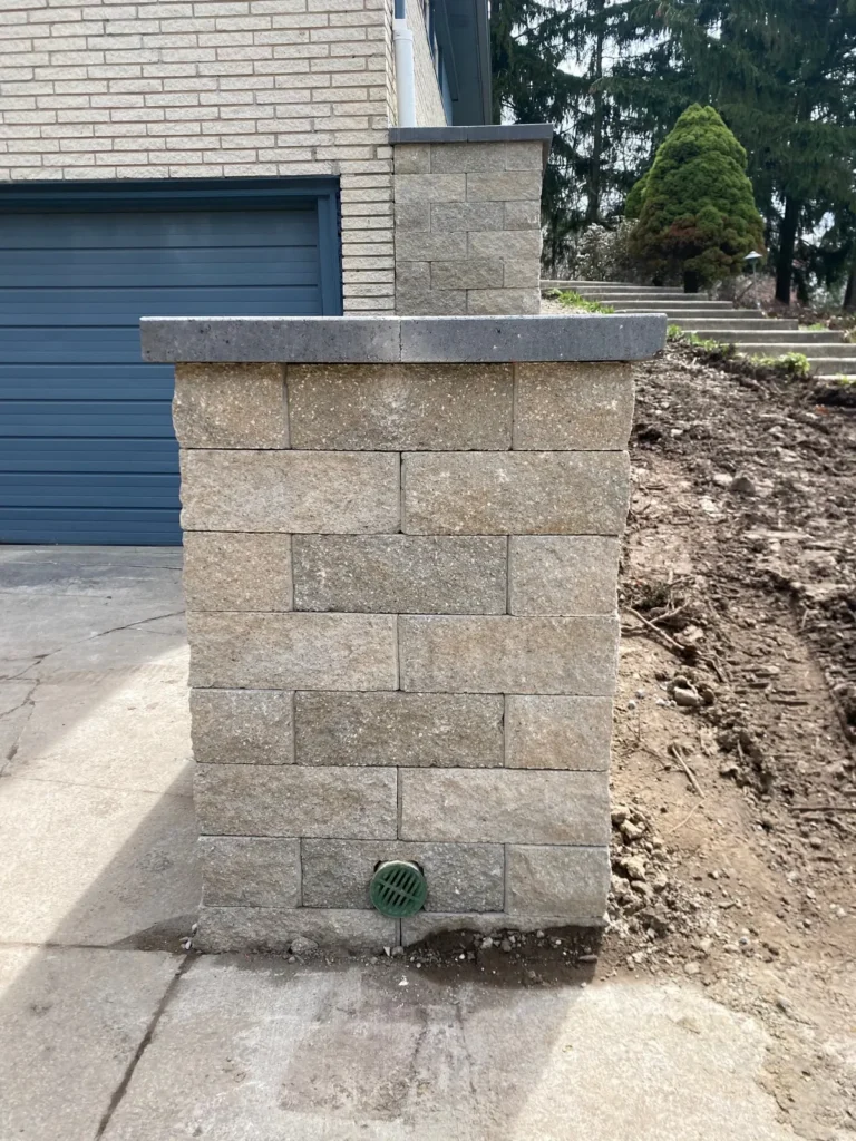 Block planter wall rebuild by the garage, completed by It's The Brick Guys in Metro Detroit