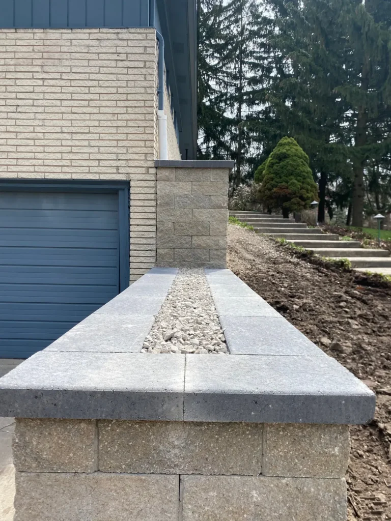 Block planter wall rebuild by the garage, completed by It's The Brick Guys in Metro Detroit (view 2)