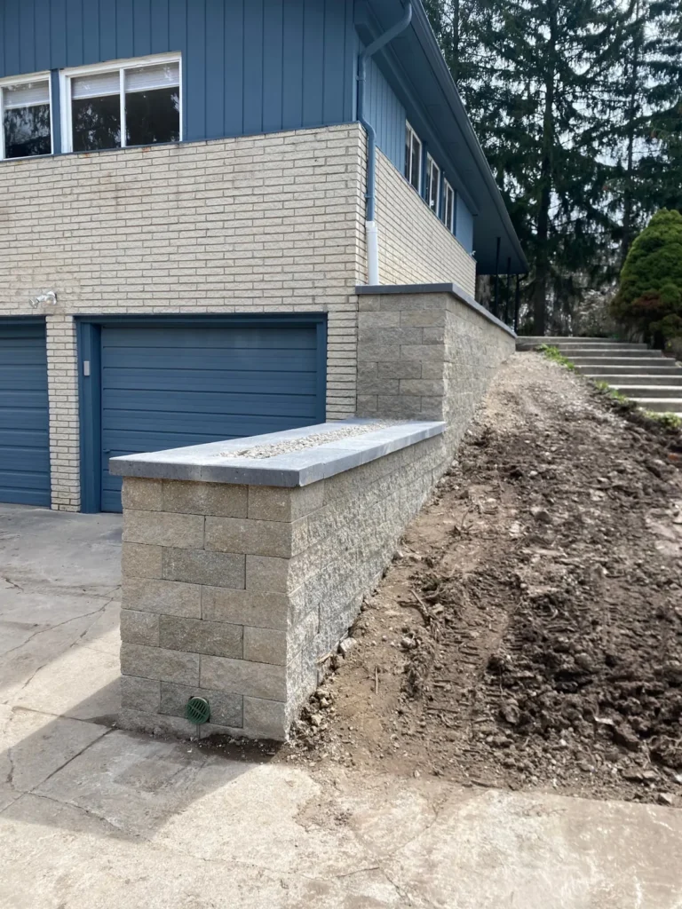Block planter wall rebuild by the garage, completed by It's The Brick Guys in Metro Detroit (view 4)
