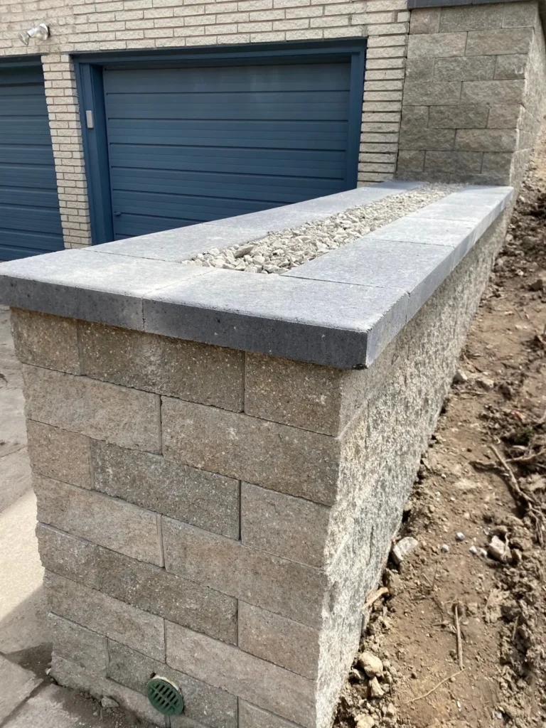 Block planter wall rebuild by the garage, completed by It's The Brick Guys in Metro Detroit (view 5)