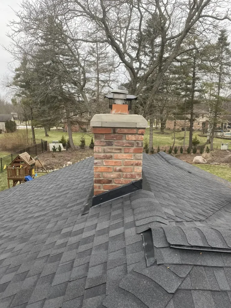 Brick chimney rebuild and new crown, completed by It's The Brick Guys in Metro Detroit