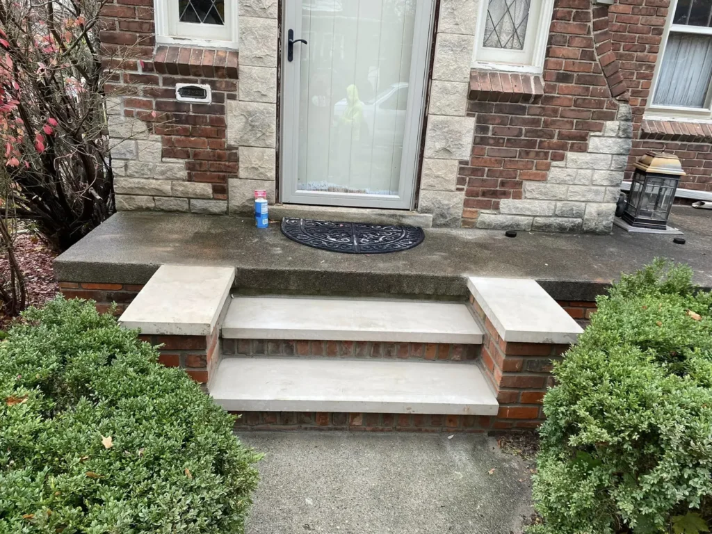Brick front steps rebuilt with stone treads, completed by It's The Brick Guys in Metro Detroit