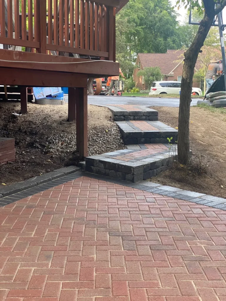 Brick paver patio with fire pit, completed by It's The Brick Guys in Metro Detroit