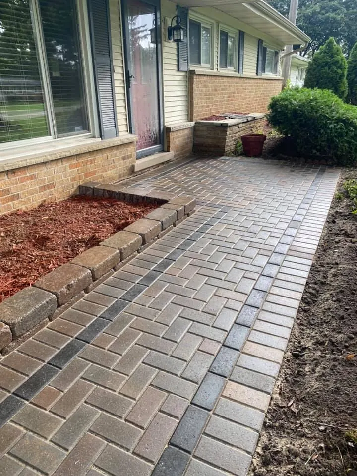 Brick paver walkway replacing flagstone, completed by It's The Brick Guys in Metro Detroit