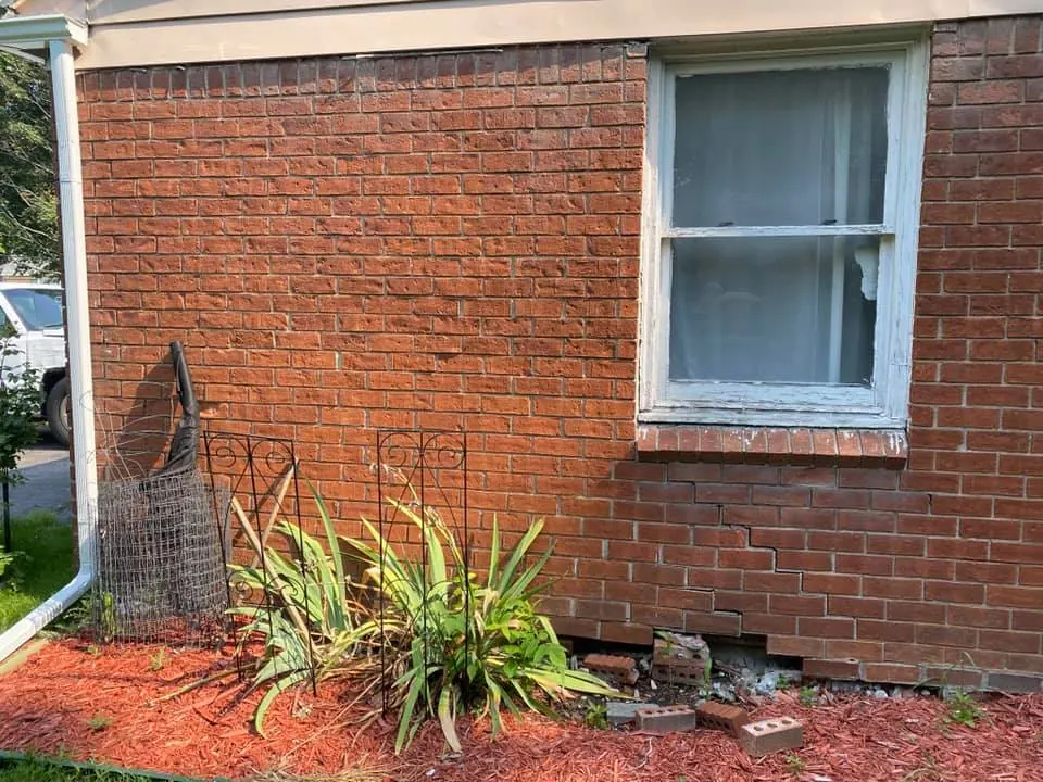 Before: brick wall repair on a ranch home job before work started