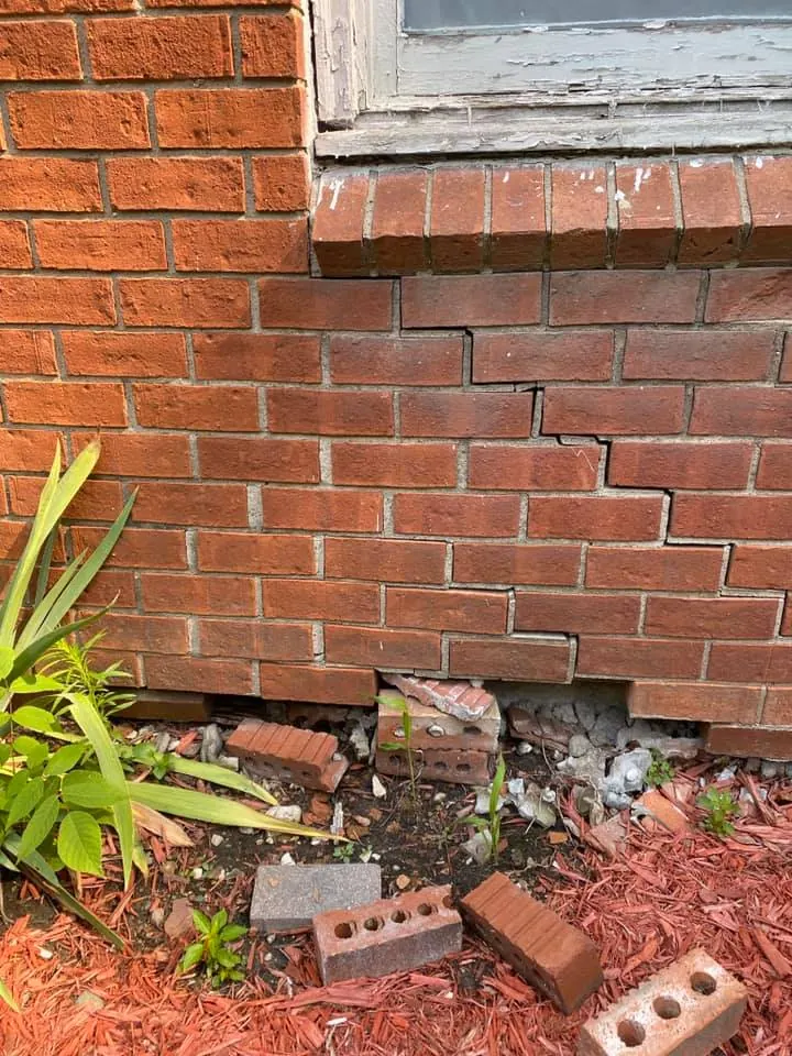 Before: brick wall repair on a ranch home job before work started
