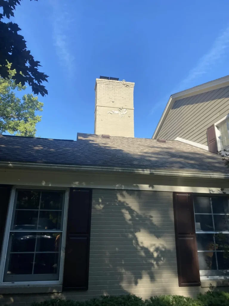 Before: chimney rebuilt above the roofline job before work started