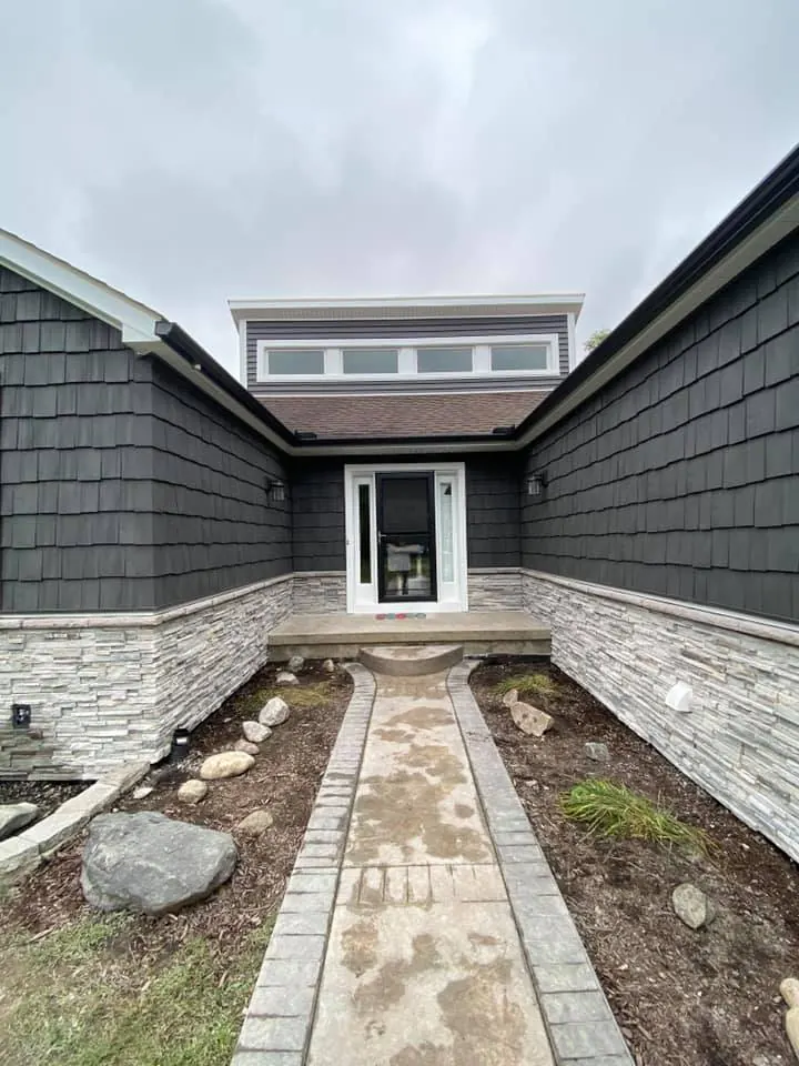 Cultured stone wainscot on a new home, completed by It's The Brick Guys in Metro Detroit