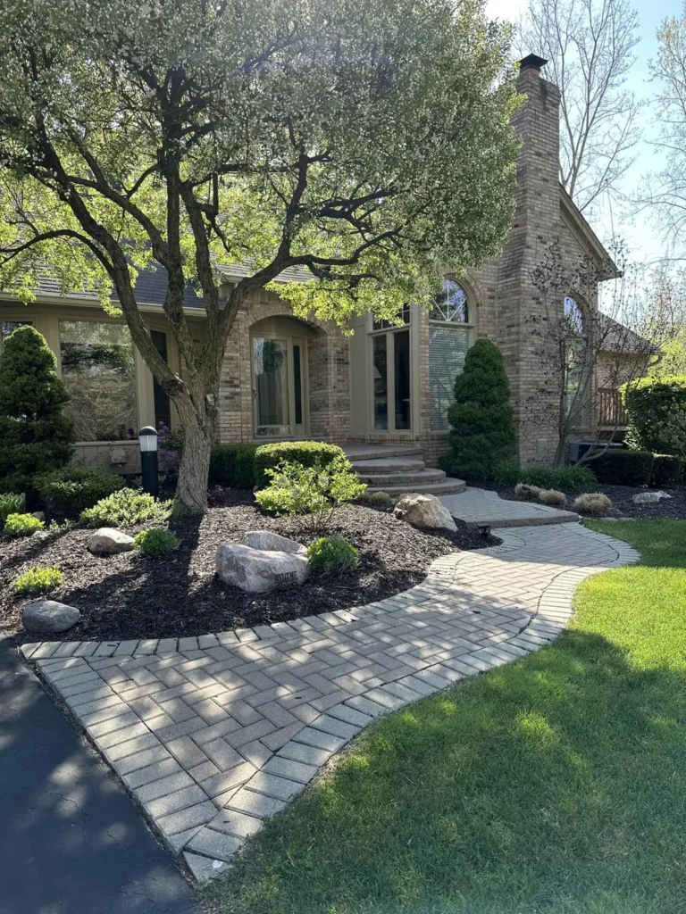 Before: curved red paver front walkway job before work started
