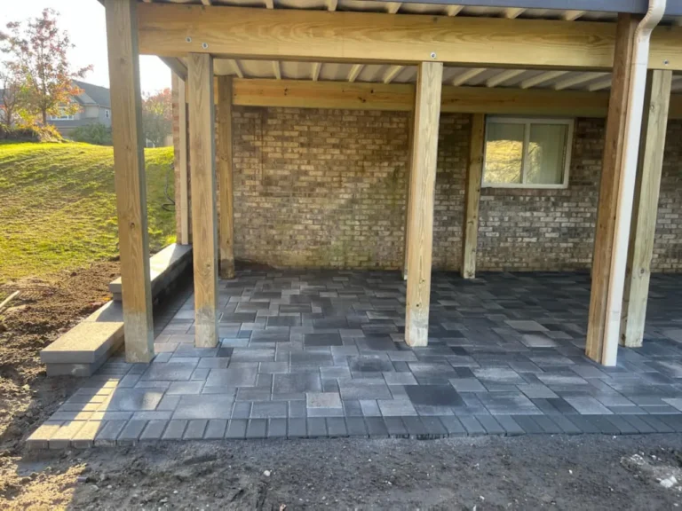 Fendt gray paver patio under a deck, completed by It's The Brick Guys in Metro Detroit (view 3)