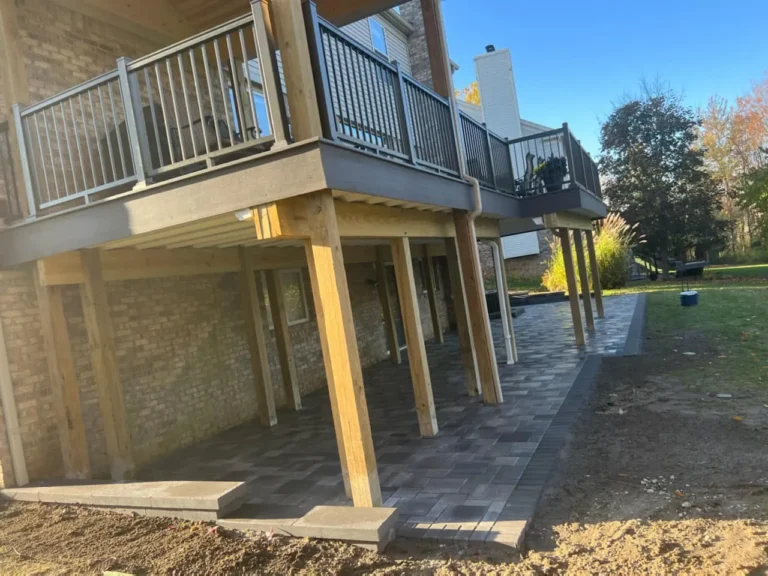 Fendt gray paver patio under a deck, completed by It's The Brick Guys in Metro Detroit (view 4)