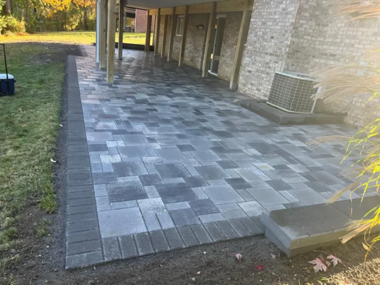 Fendt gray paver patio under a deck, completed by It's The Brick Guys in Metro Detroit (view 5)