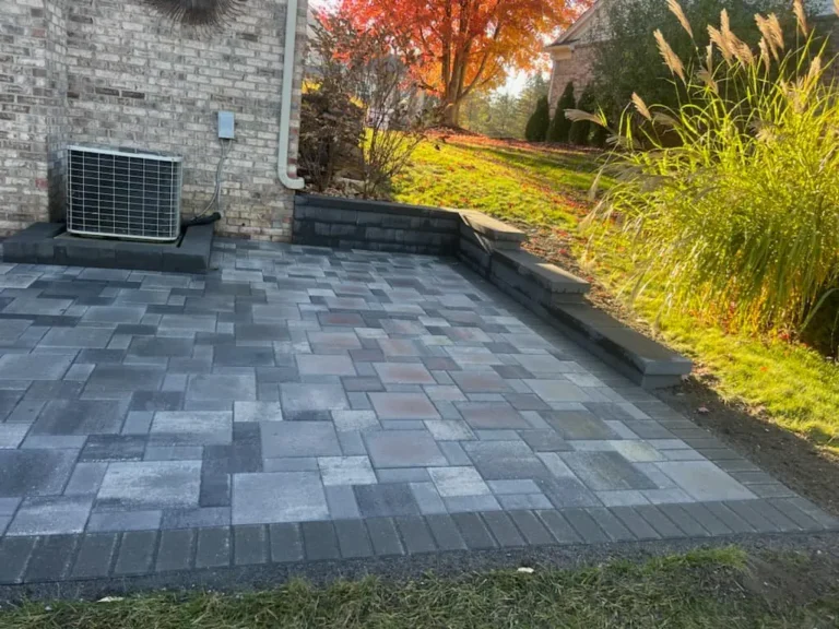 Fendt gray paver patio under a deck, completed by It's The Brick Guys in Metro Detroit (view 7)