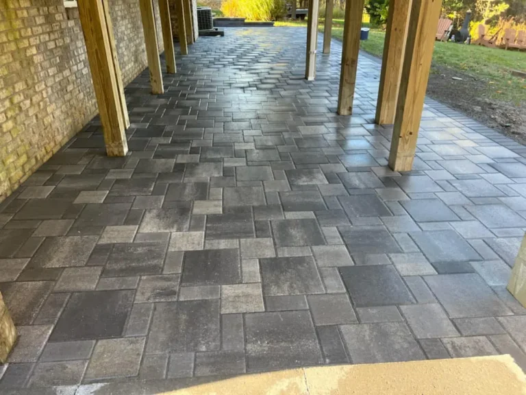 Fendt gray paver patio under a deck, completed by It's The Brick Guys in Metro Detroit (view 9)