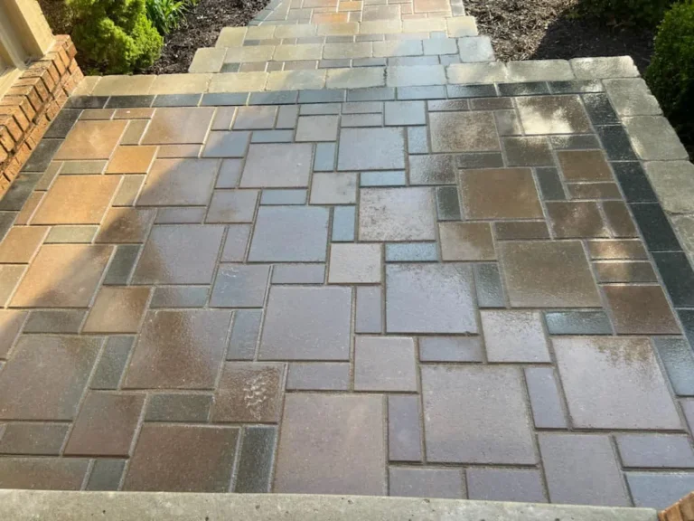 Multi-color flagstone-pattern paver landing with charcoal border in Birmingham, MI