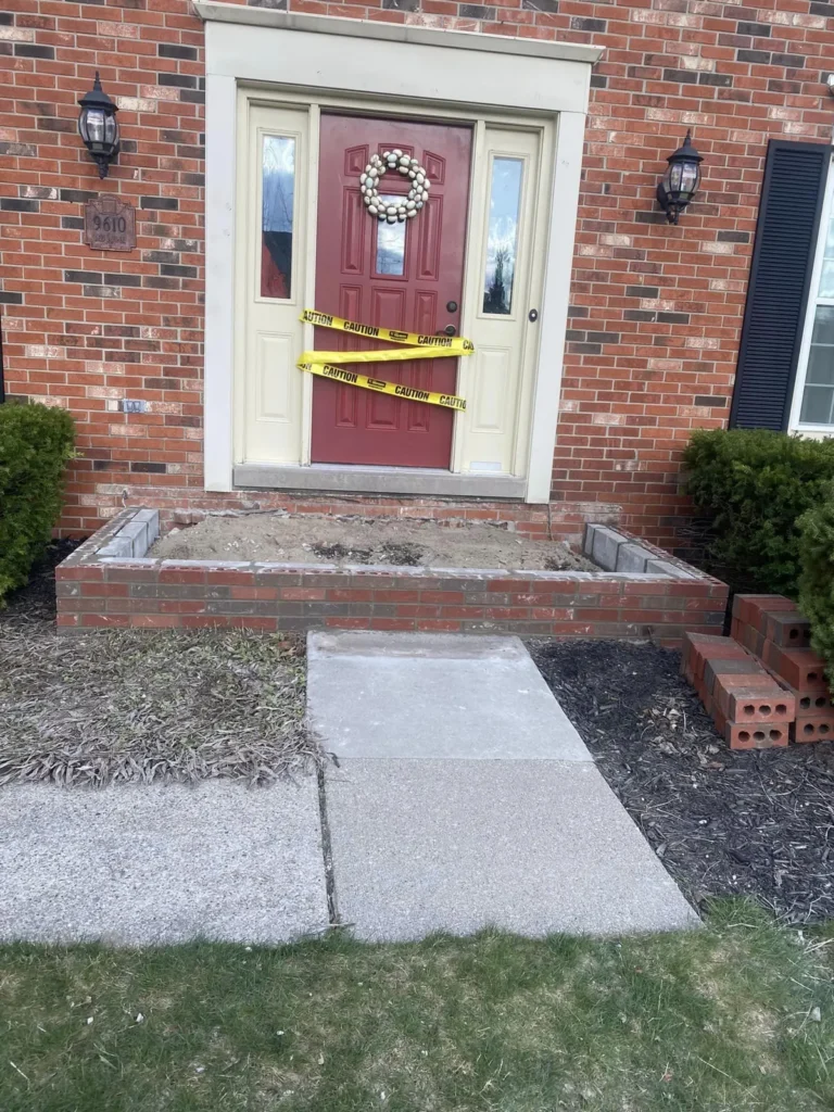Before: front porch rebuilt with stone landing job before work started