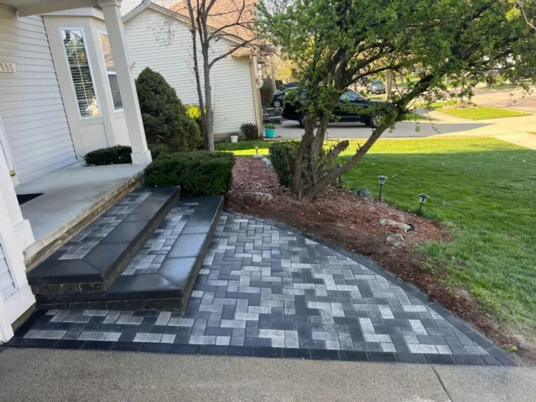 Gray paver porch and steps, completed by It's The Brick Guys in Metro Detroit