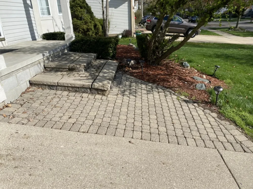 Before: gray paver porch and steps job before work started
