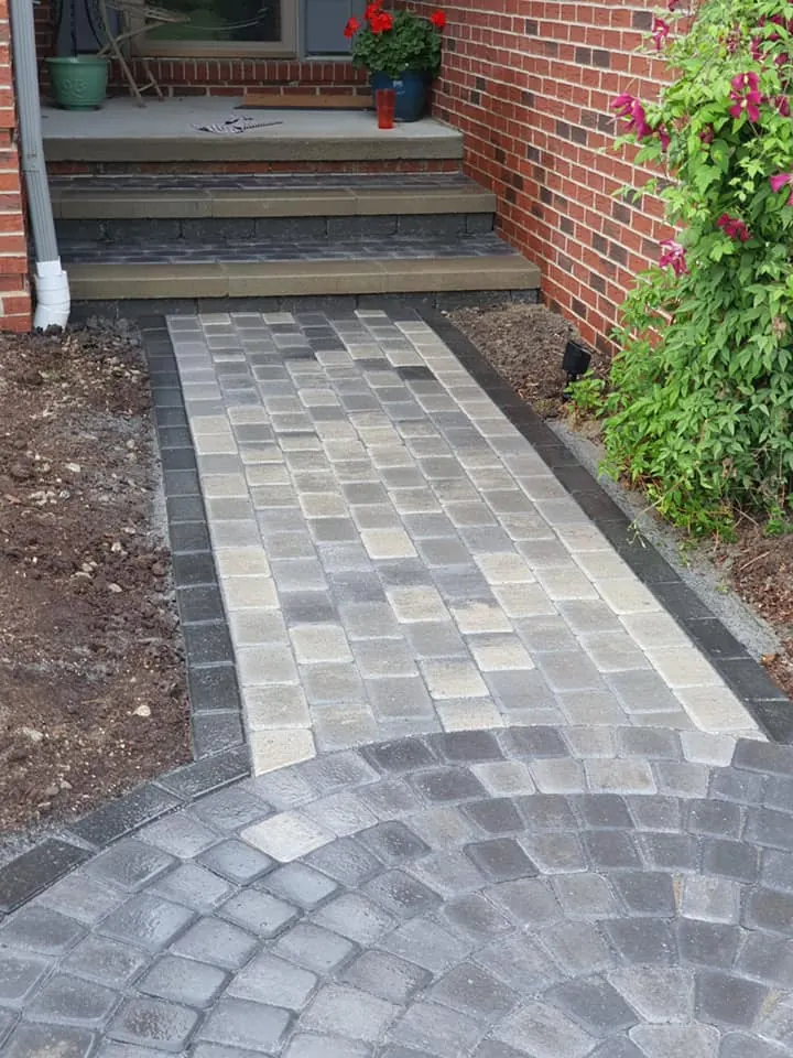 Gray paver walkway with round landing, completed by It's The Brick Guys in Metro Detroit