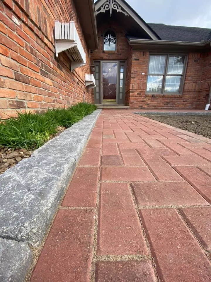 Herringbone and gray paver front walkways, completed by It's The Brick Guys in Metro Detroit