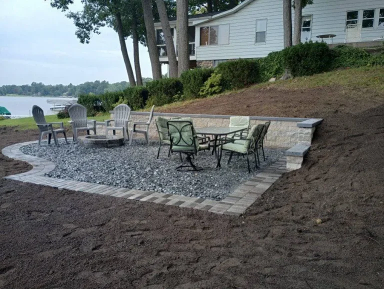 Lakefront patio with fire pit, completed by It's The Brick Guys in Metro Detroit (view 2)