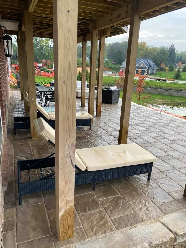 Lakefront paver patio under a deck, completed by It's The Brick Guys in Metro Detroit (view 2)