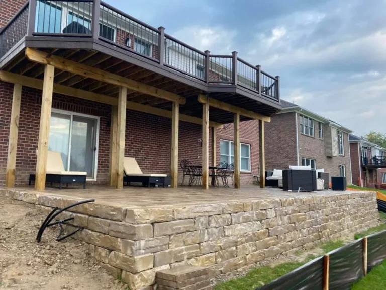 Lakefront paver patio under a deck, completed by It's The Brick Guys in Metro Detroit (view 5)