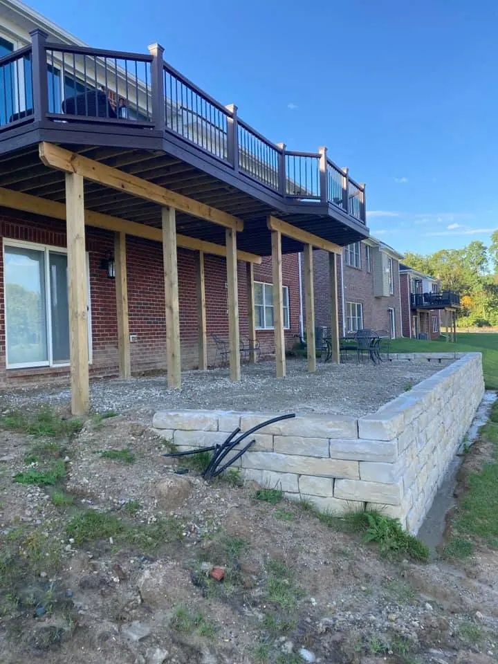 Before: lakefront paver patio under a deck job before work started