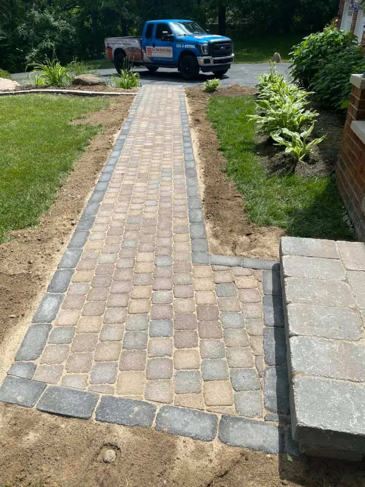 Long tan paver walkway with border, completed by It's The Brick Guys in Metro Detroit