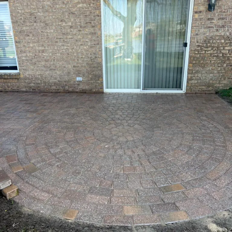 Restored paver patio with a curved edge in Sterling Heights, MI