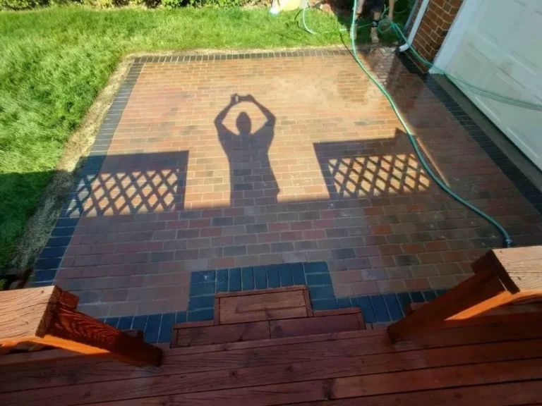 Red brick patio replacing a deck, completed by It's The Brick Guys in Oak Park, MI
