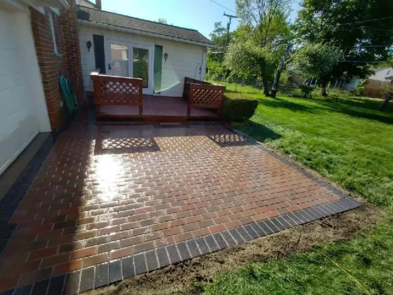 Red brick patio replacing a deck, completed by It's The Brick Guys in Oak Park, MI (view 2)