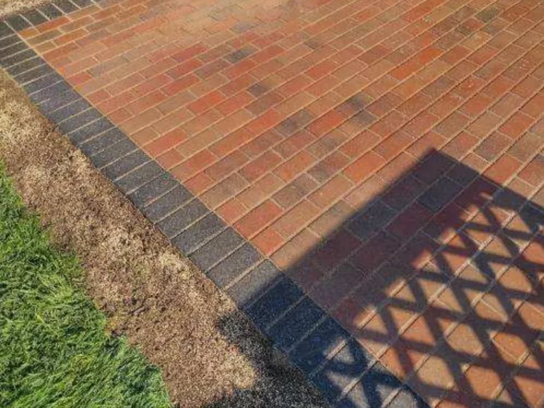 Red brick paver patio with charcoal soldier-course border in Oak Park, MI