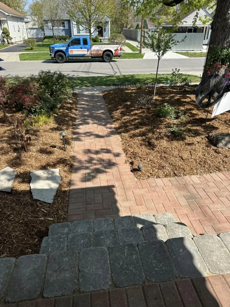 Red paver walkway and patio with pergola, completed by It's The Brick Guys in Metro Detroit