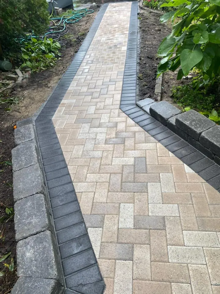 Tan paver walkway replacing concrete, completed by It's The Brick Guys in Metro Detroit (view 2)