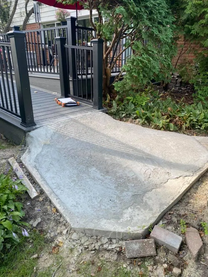 Before: tan paver walkway replacing concrete job before work started