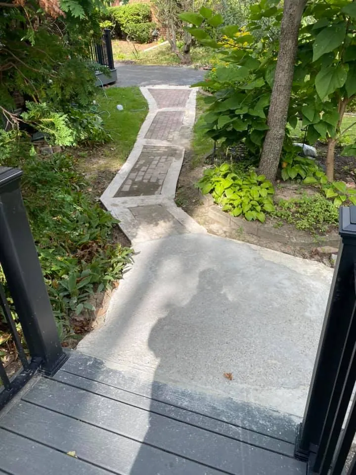 Before: tan paver walkway replacing concrete job before work started
